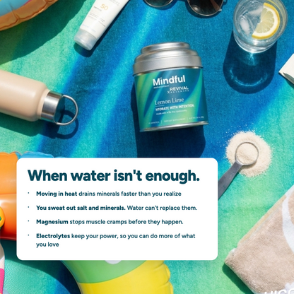Mindful Lemon Lime electrolyte tin on a beach towel with sunscreen and sunglasses — when water isn't enough